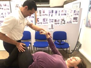 A chiropractor caring for a pregnant woman
